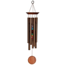 Copper wind chime with colorful beads and a wooden pendulum