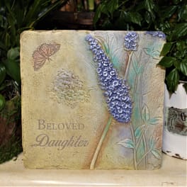 Decorative plaque with purple flowers and the words "Beloved Daughter"