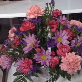 Pink and purple mixed flower bouquet with carnations and daisies