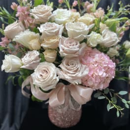 Blush and white roses with pink hydrangea in a pink vase
