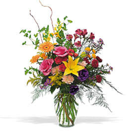 Colorful mixed bouquet in a clear glass vase