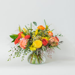 Colorful mixed bouquet in a clear glass vase