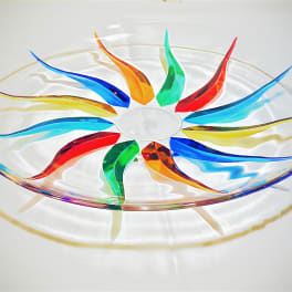 Colorful glass bowl with a rainbow swirl pattern