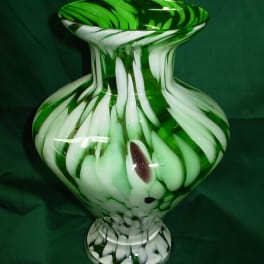 Green and white glass vase with swirled pattern