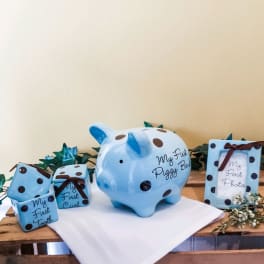 Blue polka-dot baby keepsakes on a wooden table