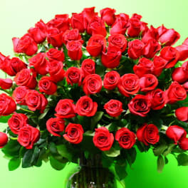 Large bouquet of red roses in a glass vase