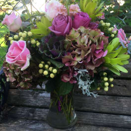 Pink and purple bouquet in a glass vase