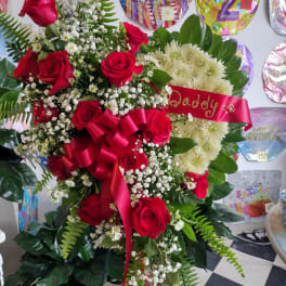 Large red rose and white chrysanthemum arrangement with a birthday ribbon
