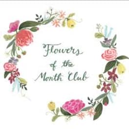Floral wreath with the words "Flowers of the Month Club" in the center