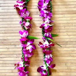 Kui purple flower lei with ti leaf lei wrap