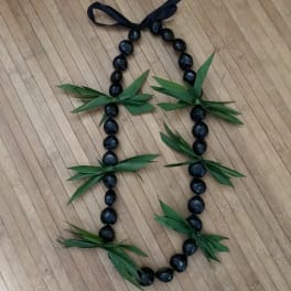 Kukui Nut lei with ti leaf