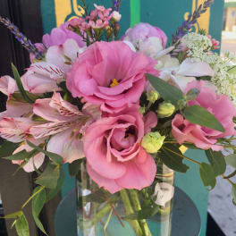 Pink and white bouquet in a clear glass vase