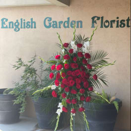 Standing floral spray of red roses and white gladiolus