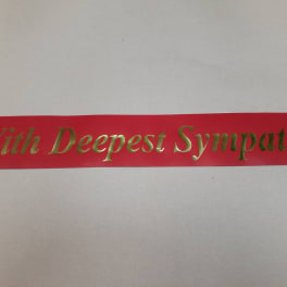 Red ribbon with gold "With Deepest Sympathy" text