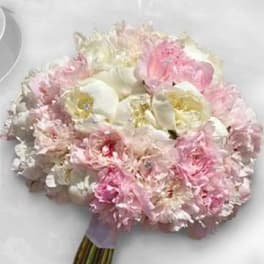 Pink and white bouquet with large white blooms and pale pink flowers