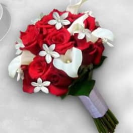 Red rose bouquet with white calla lilies and small white flowers