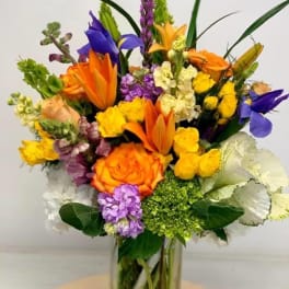 Colorful mixed bouquet in a clear glass vase