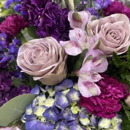 Bouquet of lavender roses, purple flowers, and blue hydrangea