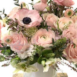 Pink and white mixed bouquet in a white vase
