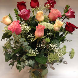 Bouquet of red and pink roses in a glass vase