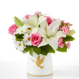 Pink and white flower arrangement in a white vase