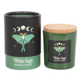 Two white sage scented candles in green jars with black labels and cork lids
