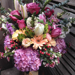 Mixed bouquet with pink roses, lilies, hydrangeas, and gerbera daisies