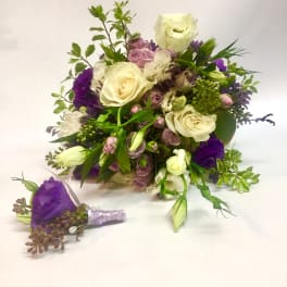 Bouquet of white and purple flowers with a matching boutonniere