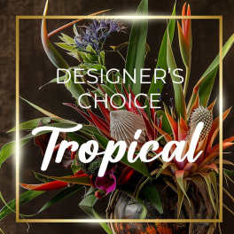 Tropical floral arrangement with orange bird-of-paradise and red blooms