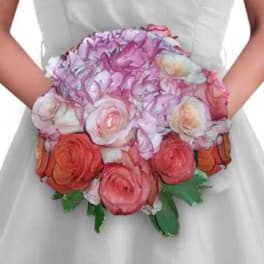 Handheld bouquet of pink, lavender, and coral roses