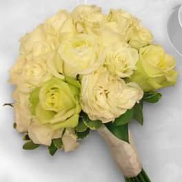 Bouquet of pale yellow roses wrapped in beige paper