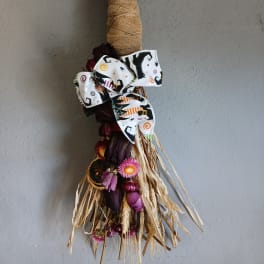 Dried floral bundle with a Halloween ribbon bow