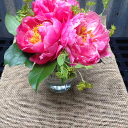 Pink peony bouquet in a clear glass vase