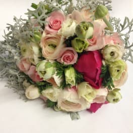 Bouquet of pale pink and cream flowers with silvery foliage