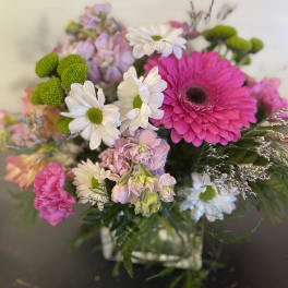 Bouquet of pink and white flowers in a glass vase