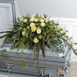 White rose casket spray with cascading greenery