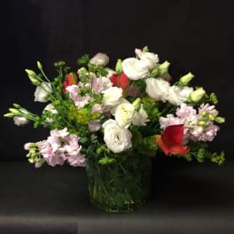 Bouquet of white and pink flowers in a glass vase