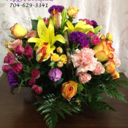 Mixed bouquet of yellow lilies, roses, and carnations