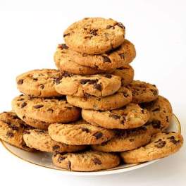 Stack of chocolate chip cookies on a white plate