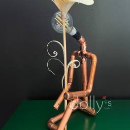 Copper pipe figure holding a white flower with a light bulb head