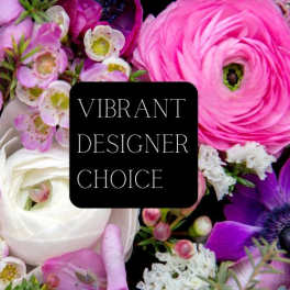 Mixed bouquet of pink, white, and purple flowers with a designer choice label