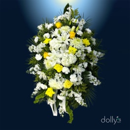 White and yellow floral standing spray with ribbon tails