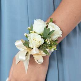 White rose wrist corsage with cream ribbon