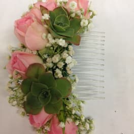 Pink rose hair comb with green succulents and white filler flowers