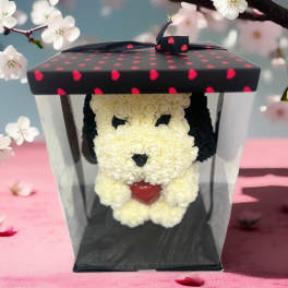 Panda-shaped floral gift in a clear box with a heart-patterned lid