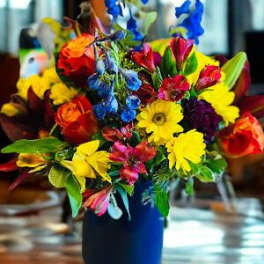 Colorful mixed bouquet in a blue vase