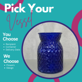 Blue glass vase with a textured geometric pattern