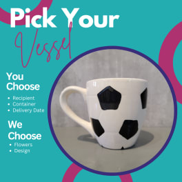 White mug with black cow spots on a teal promotional background
