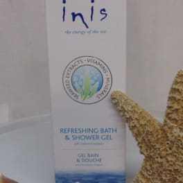 Bottle of Inis refreshing bath and shower gel with seashells