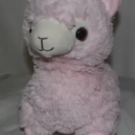 Pink plush llama stuffed animal with a white face and black eyes